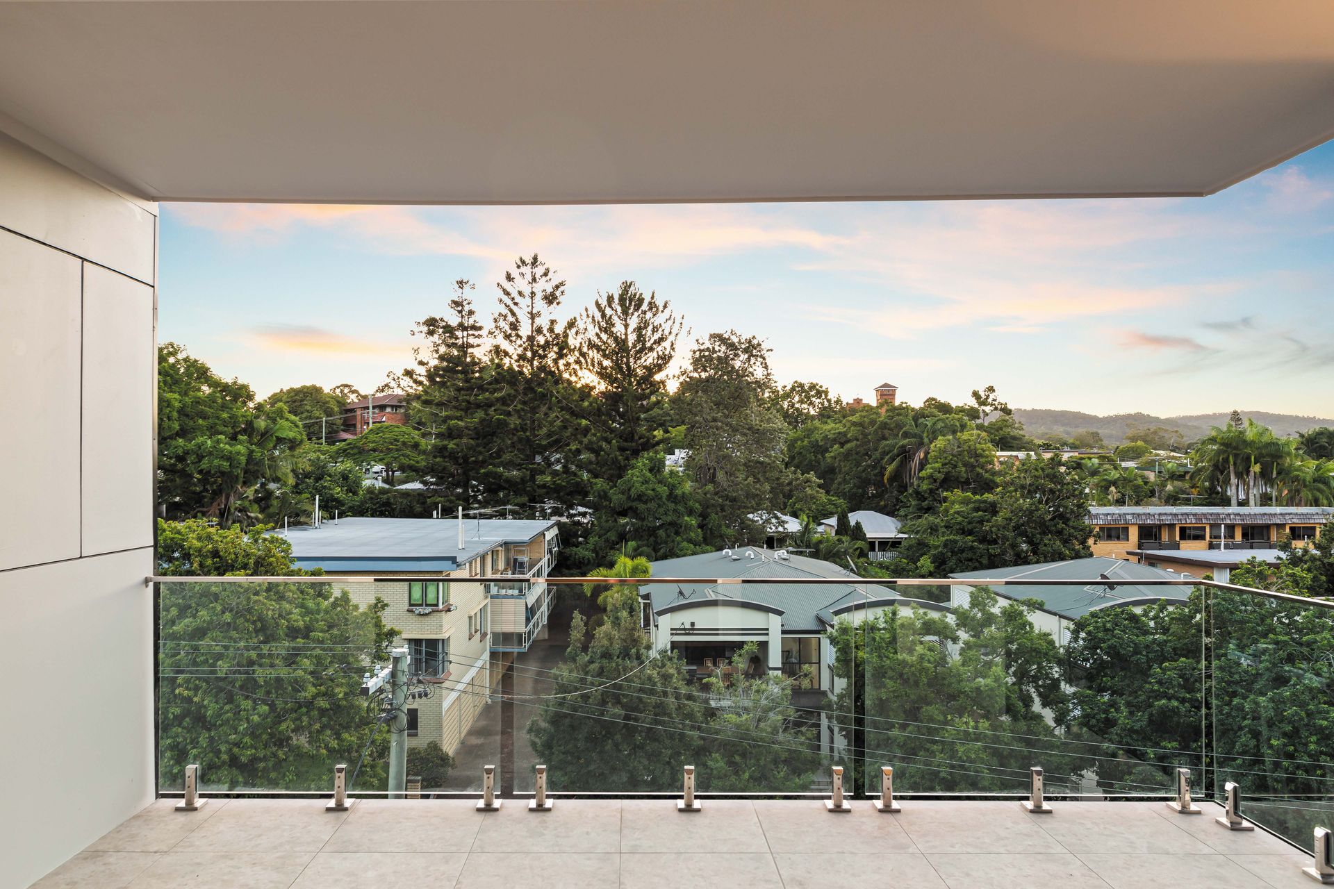 Balcony treetop view at sunset