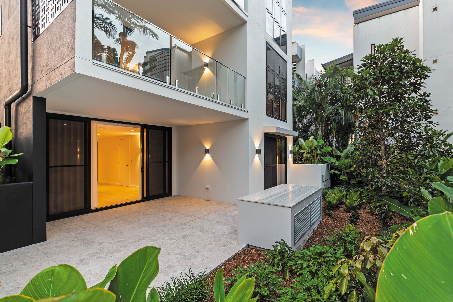 Holland Residences courtyard and landscaping at dusk