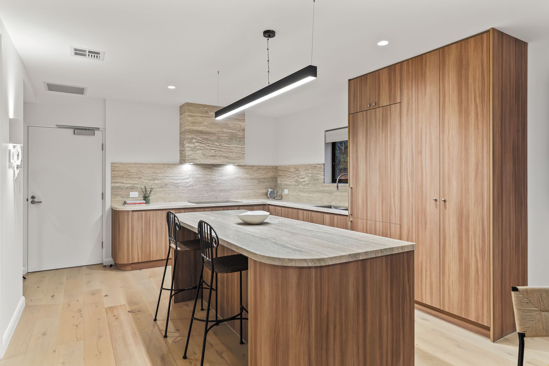 Kitchen - island bench with travertine stone